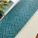 Khroma|Wallpaper with green herringbone spikes with ethnic shine|Wallpaper